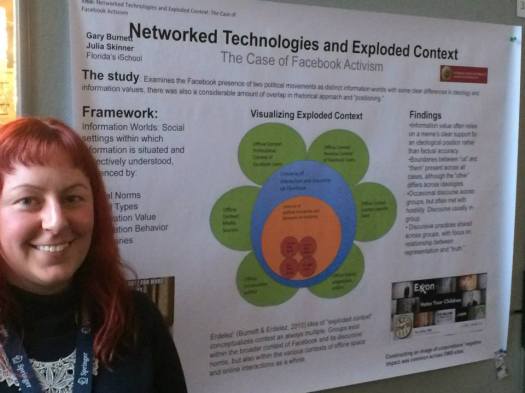 Standing next to our poster. Photo credit to my co-presenter, Gary Burnett